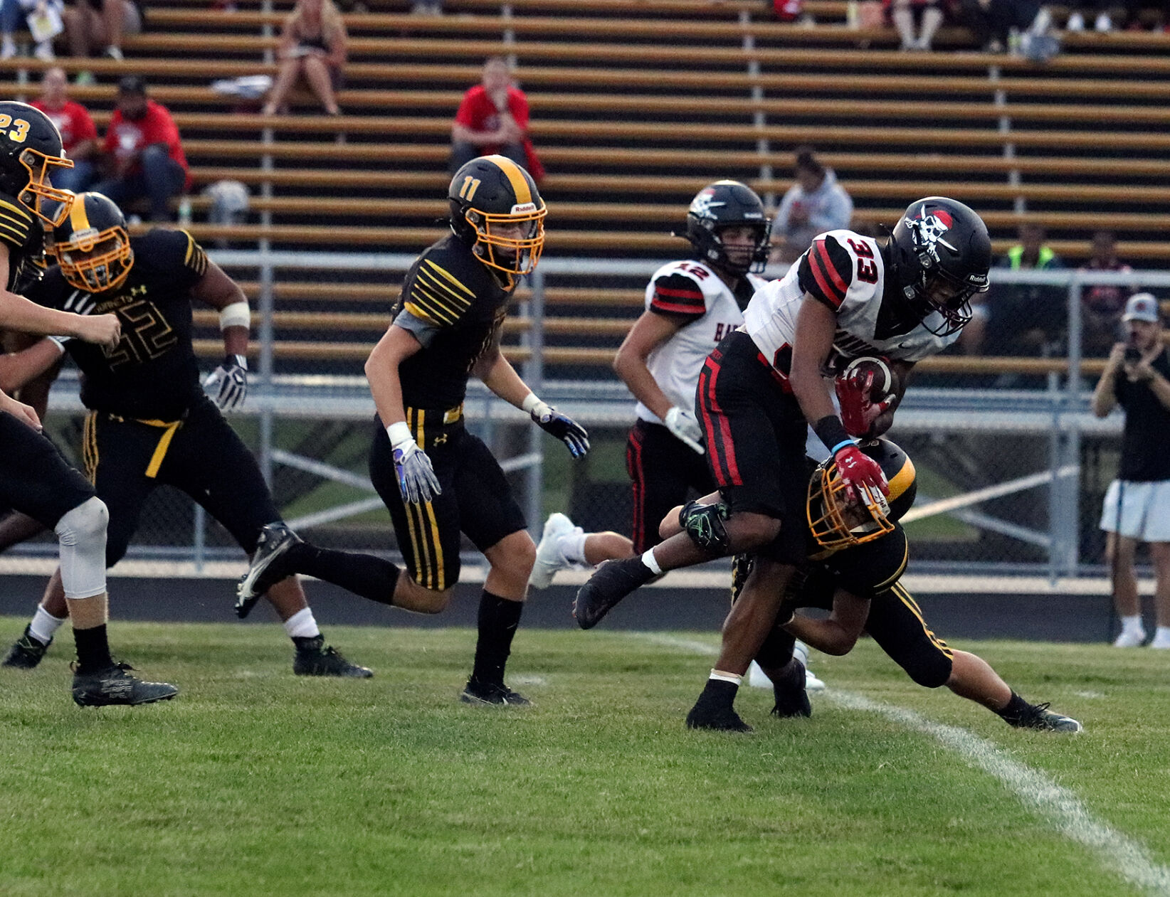 Markahl Humphrey is tackled by Marcus Garrett